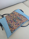 Colorful patterned cork sling bag with blue border