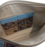 Close-up of tan lining bag with multicolour 4 card holder and cork label.