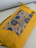 Yellow cork handbag with blue daisy pattern and tree of life emblem