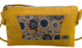 Yellow cork handbag with blue daisy pattern and tree of life emblem
